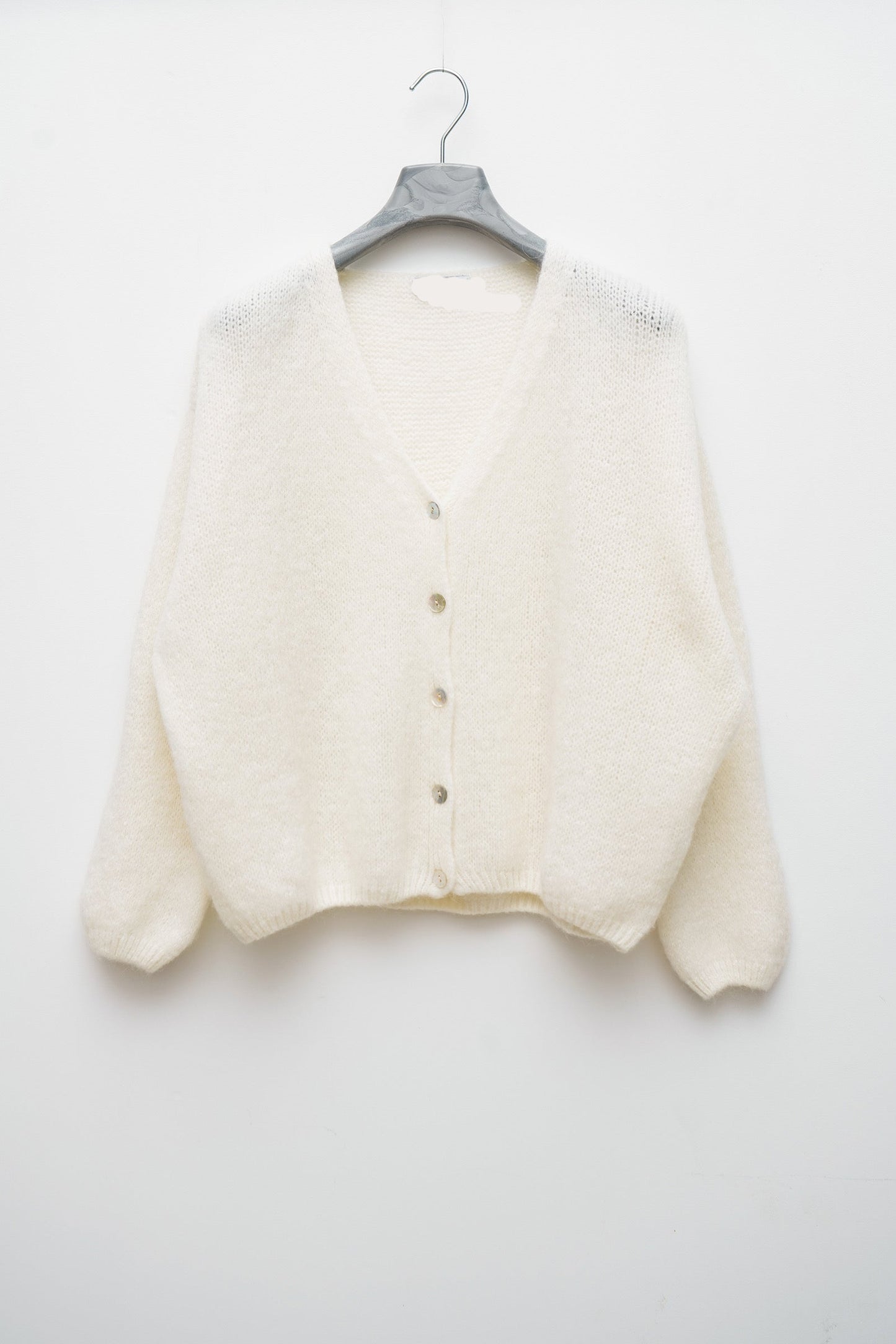 Détail du gilet taille unique, 36-42, avec sa composition en laine et mohair.