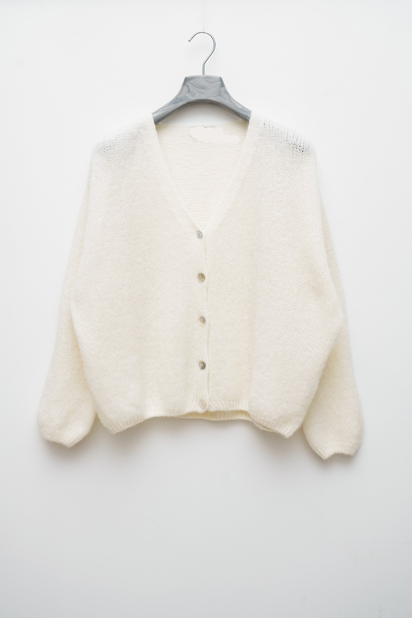 Détail du gilet taille unique, 36-42, avec sa composition en laine et mohair.