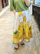 Jupe midi imprimée jungle avec motifs colorés jaune, vert – coupe évasée, style bohème, idéale pour la mode femme été.