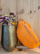 Banane matelassée orange, accessoire pratique et stylé pour toutes les occasions